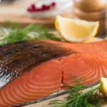 Plate of smoked salmon garnished with herbs and lemon, highlighting its health benefits and nutritional value